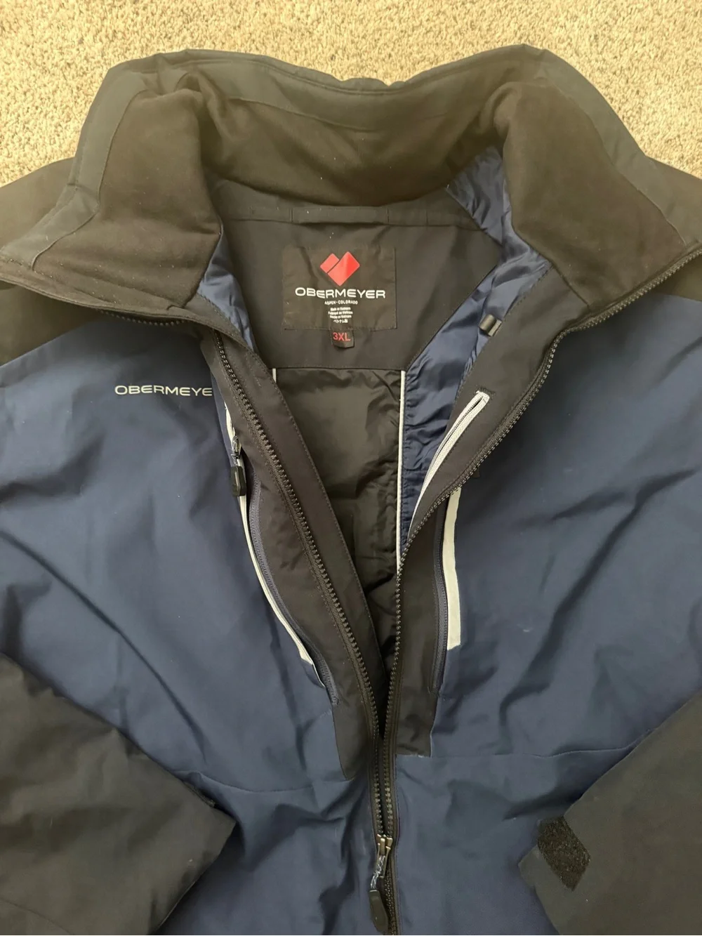 Obermeyer Blue and Black Ski Jacket with Reflective Accents